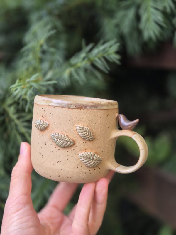Ceramic mug with bird
