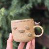 Ceramic mug with bird