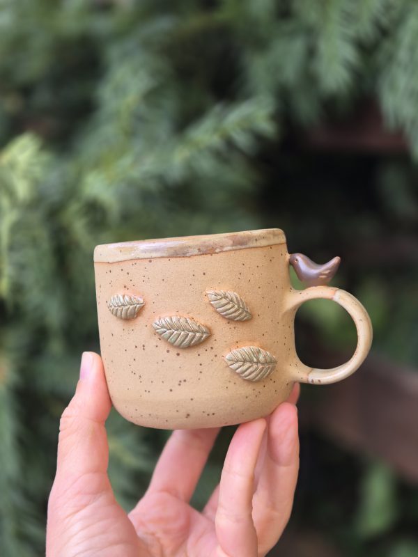 Ceramic mug with bird